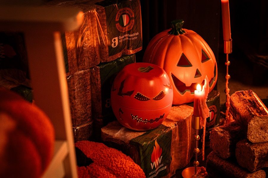 Halloween pumpkins sitting on bales of WillowWarm