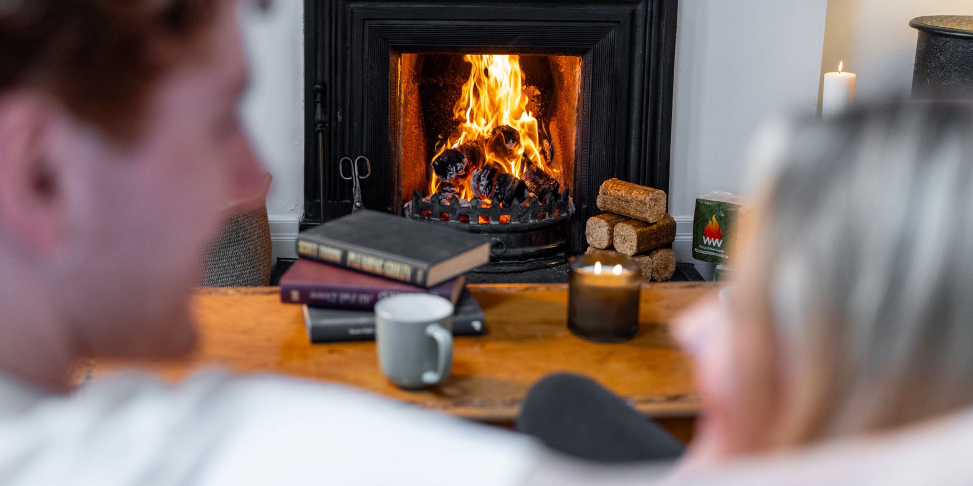 WillowWarm Briquette bales sitting in front of an open fire