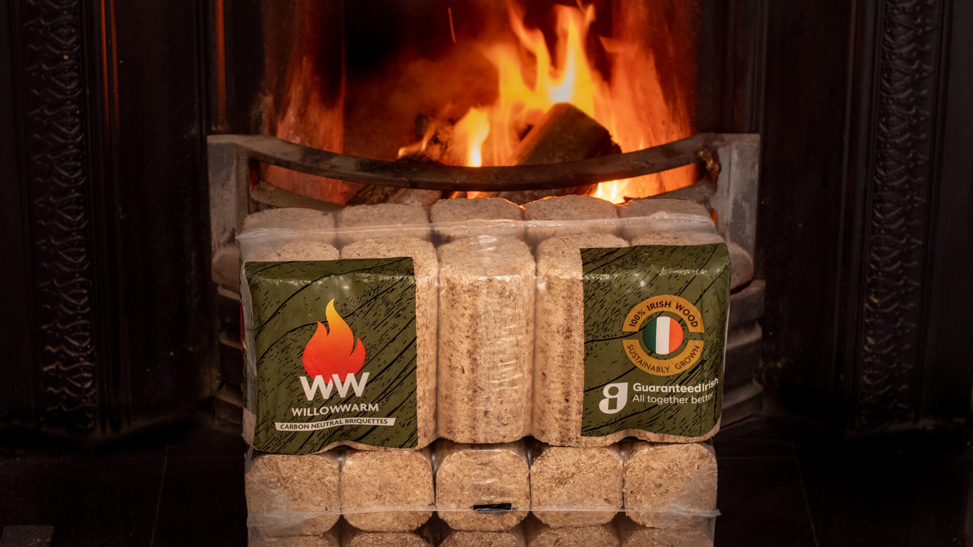 WillowWarm Briquette bales sitting in front of an open fire