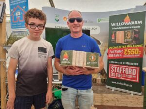 Declan and son winning a pallet of WillowWarm Briquettes